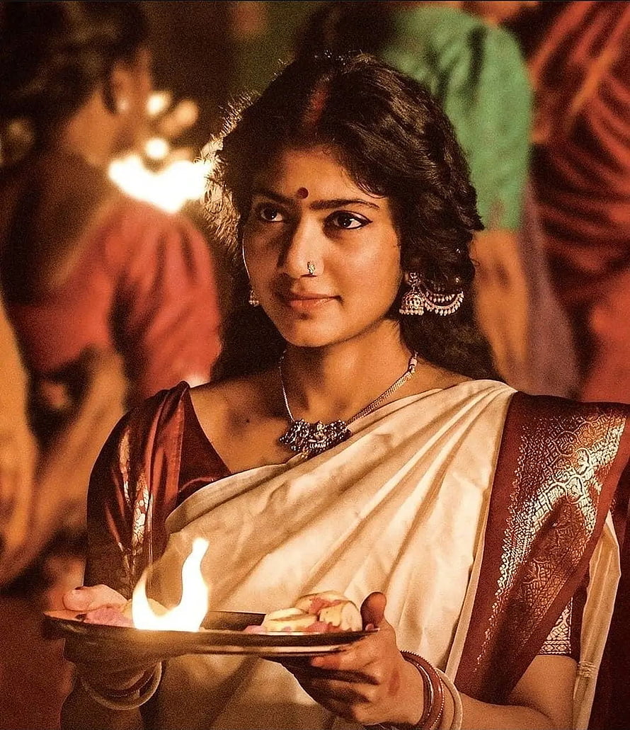 Sai Pallavi as Shyam Singha Roy Holding a Traditional Oil Lamp During a Festival HD phone wallpaper