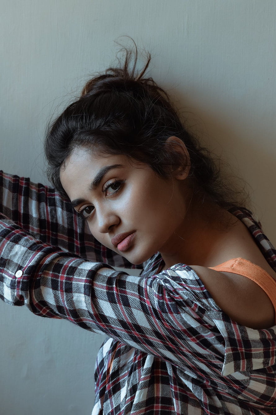 Teju Ashwini Portrait in Plaid Shirt with Messy Updo and Soft Natural Lighting HD phone wallpaper