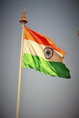 Indian National Flag Waving on a Tall Pole Against a Clear Sky HD phone wallpaper