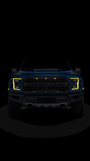 Ford Raptor Front Grille with Yellow LED Headlights on Dark Background HD phone wallpaper