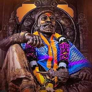 Shivaji Maharaj Statue Adorned With Marigold Garlands And Traditional Attire HD phone wallpaper