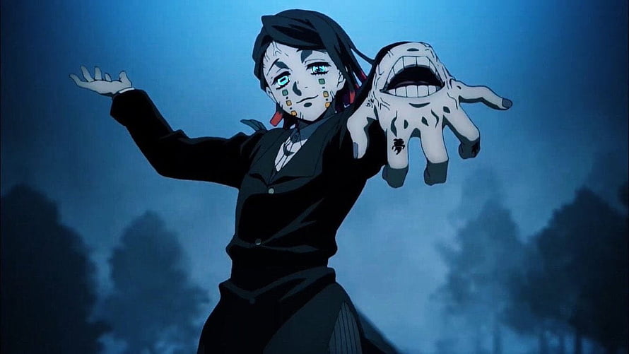 Enmu from Demon Slayer in a dark forest with a monstrous hand and glowing blue eyes HD wallpaper