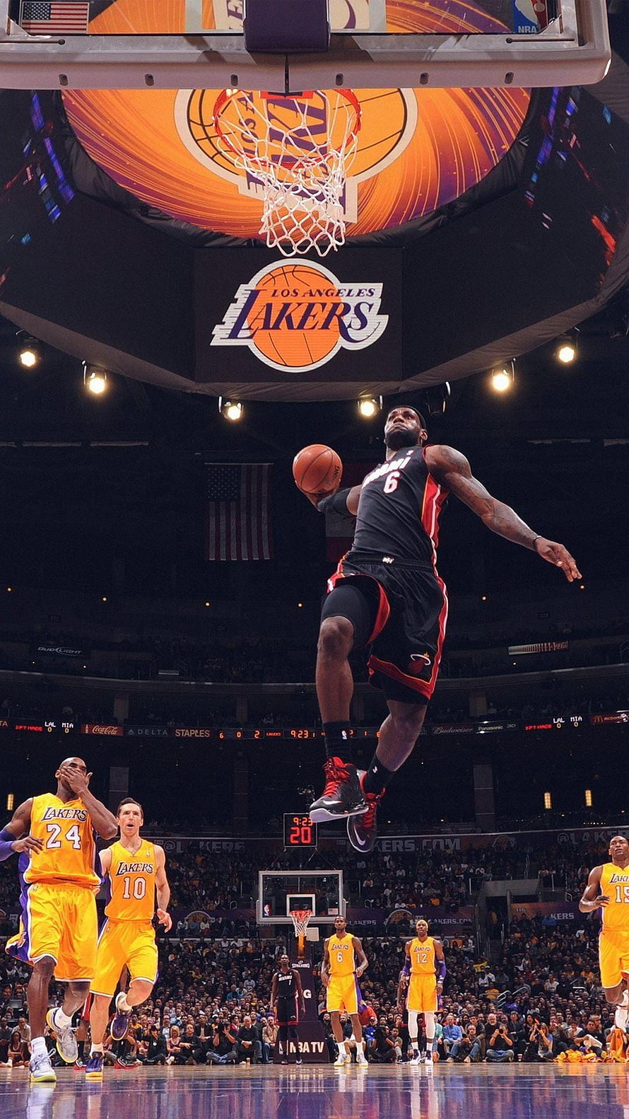 LeBron James dunking over Kobe Bryant and Lakers players at Staples Center HD phone wallpaper