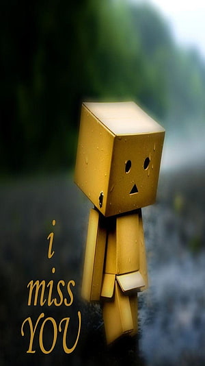 Golden Cubic Robot Toy with Sad Expression and I Miss You Text on Misty Background HD phone wallpaper