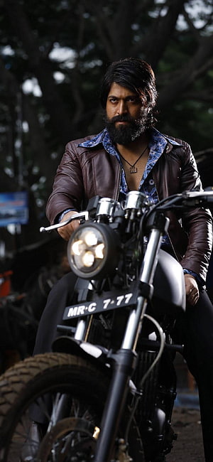 Rocky Bhai from KGF on a Custom Motorcycle in a Dark Forest Setting HD phone wallpaper
