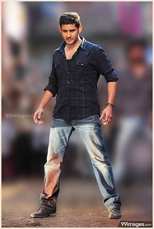 Mahesh Babu in a dark plaid shirt and distressed jeans with a serious expression HD phone wallpaper