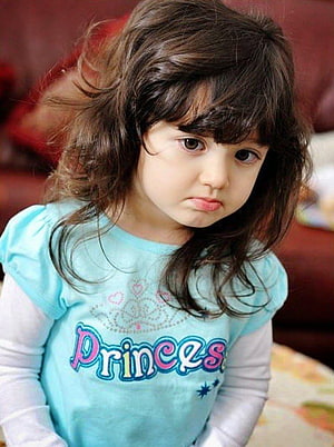 Adorable Toddler Girl With Wavy Hair Wearing A Light Blue Princess Shirt HD phone wallpaper