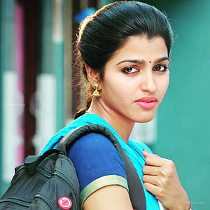 Sai Dhanshika in a blue sari with a black backpack and gold earrings HD phone wallpaper