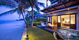 Luxury Beachfront Villa with Private Pool and Ocean View at Dusk HD wallpaper