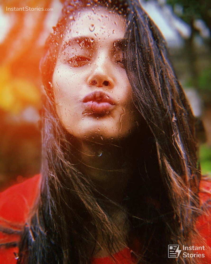 Pooja Hegde Close-Up Portrait Behind Rain-Streaked Glass with Warm Autumn Background HD phone wallpaper