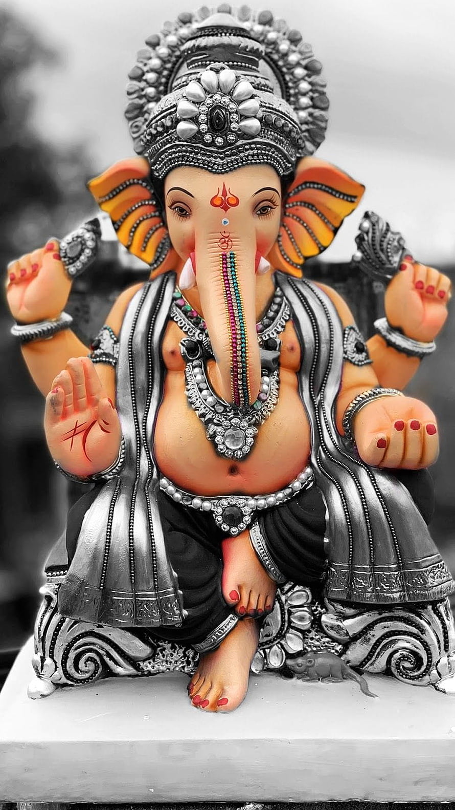 Lord Ganesha Silver Ornament Statue with Intricate Jewelry and Decorative Details HD phone wallpaper