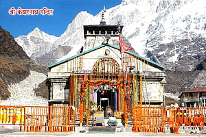 Kedarnath Temple in the Himalayas with Snow-Capped Peaks and Marigold Decorations HD wallpaper