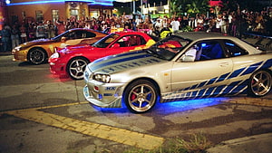 Nissan Skyline R34 and JDM Supercars at Night Street Meet with Underglow HD wallpaper
