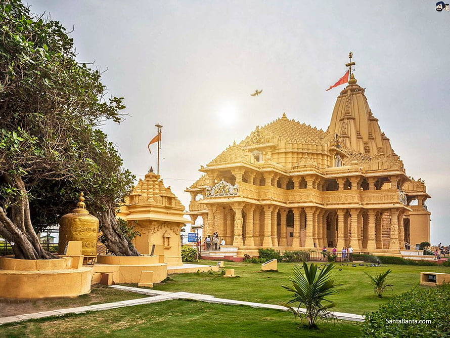 Somnath Temple in Gujarat: Golden Hindu Shrine with Ornate Carvings and Lush Green Gardens HD wallpaper