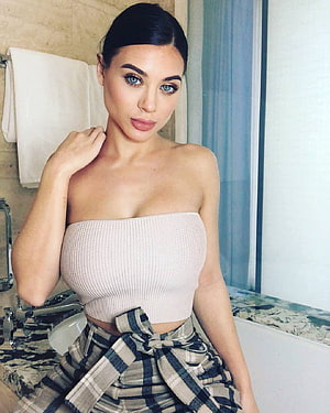 Lana Rhoades in a beige ribbed tube top and plaid shirt tied at the waist in a bathroom setting HD phone wallpaper