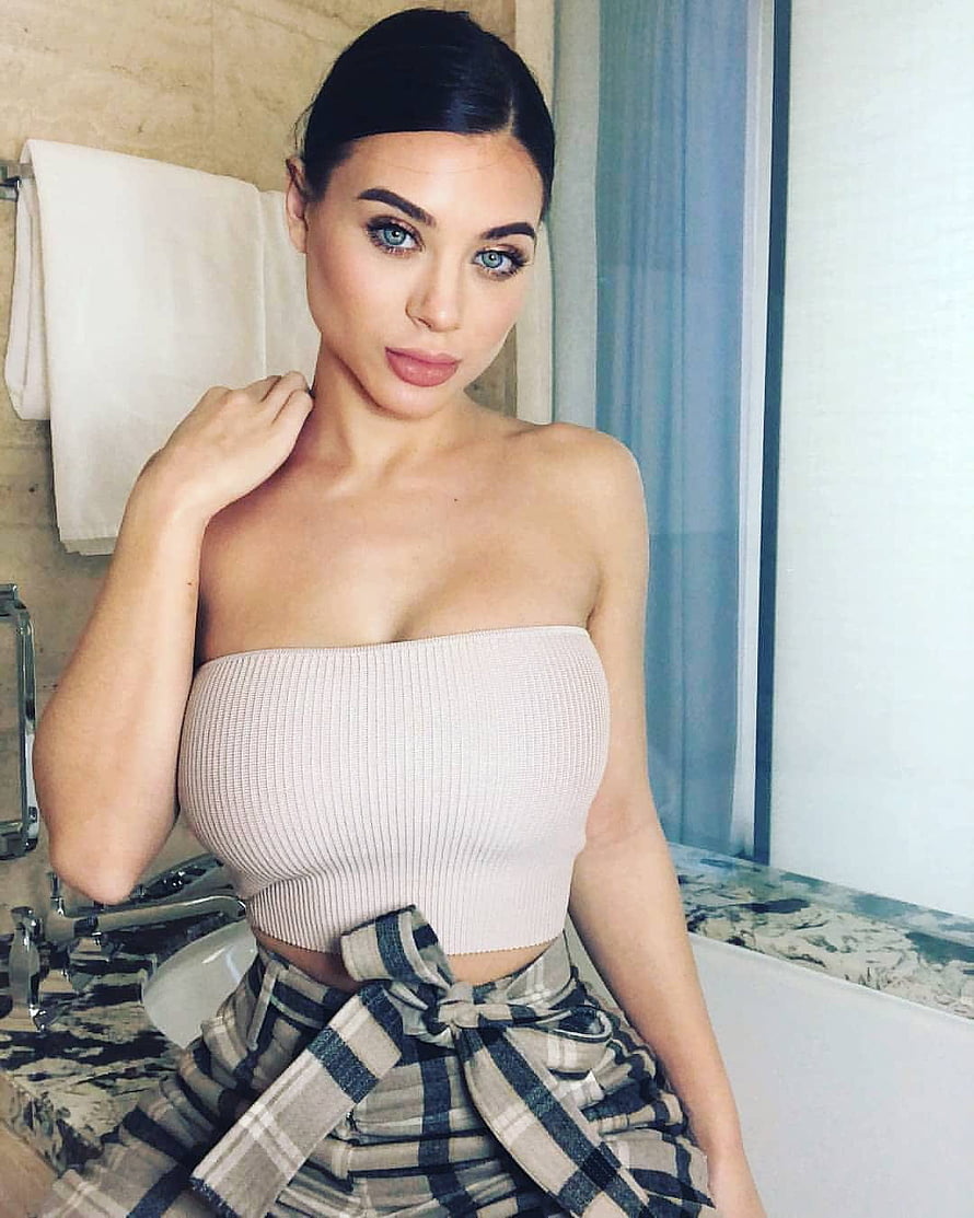 Lana Rhoades in a beige ribbed tube top and plaid shirt tied at the waist in a bathroom setting HD phone wallpaper