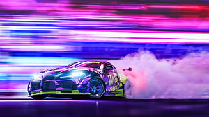 Toyota Supra Drift Car with Neon Purple and Blue Light Trails at Night HD wallpaper