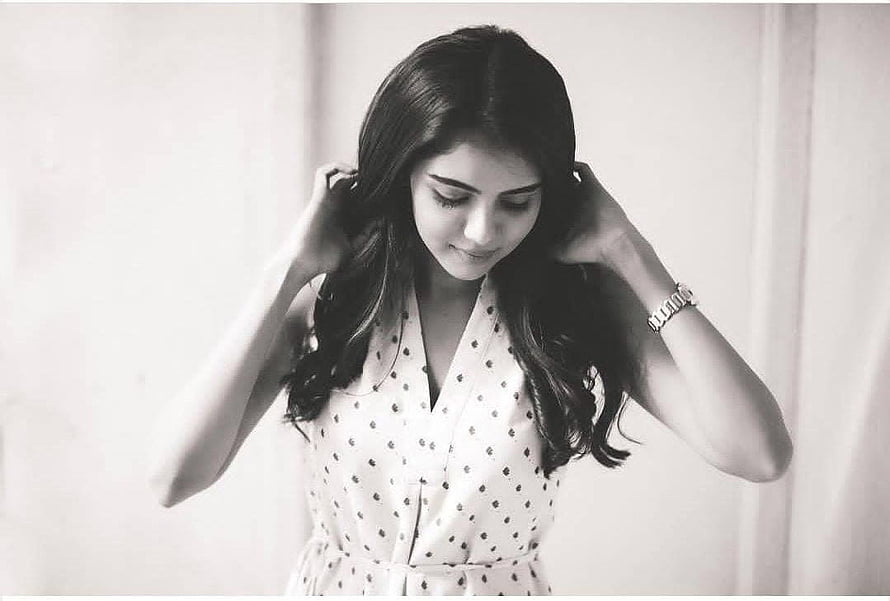 Kalyani Priyadarshan in a Polka Dot Dress with Hands in Hair HD wallpaper
