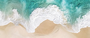 Aerial View of Turquoise Ocean Waves Crashing on Sandy Beach HD wallpaper