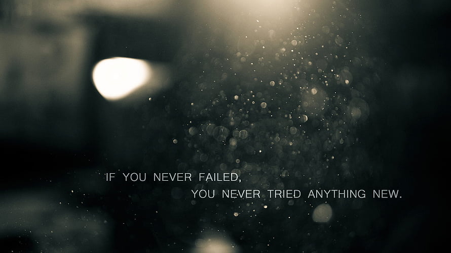 Inspirational Quote on Dark Bokeh Background with Floating Particles and Soft Light HD wallpaper