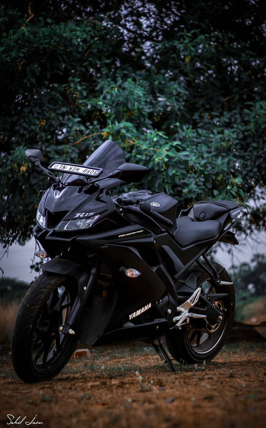 Yamaha R15 V3 Black Sport Motorcycle Parked on Dirt Road with Lush Green Foliage Background HD phone wallpaper