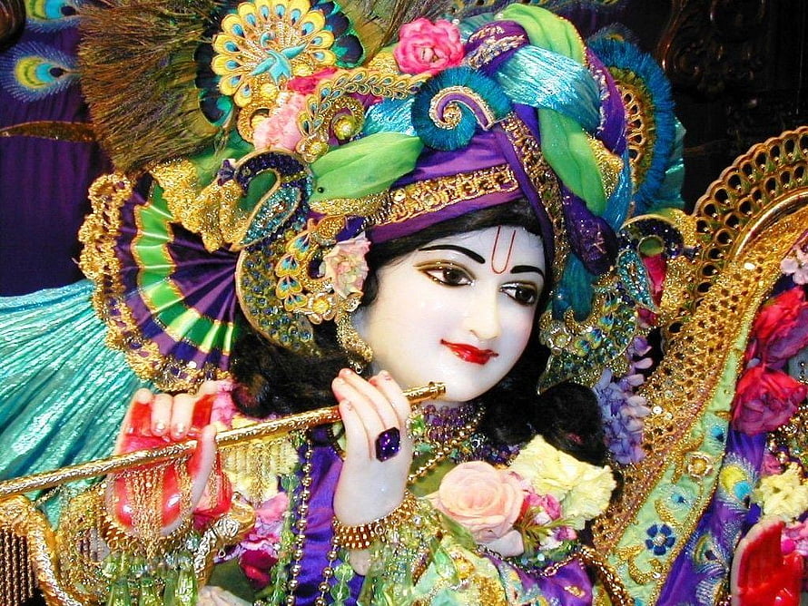 Lord Krishna Playing Flute in Ornate Peacock Crown and Festive Attire HD wallpaper