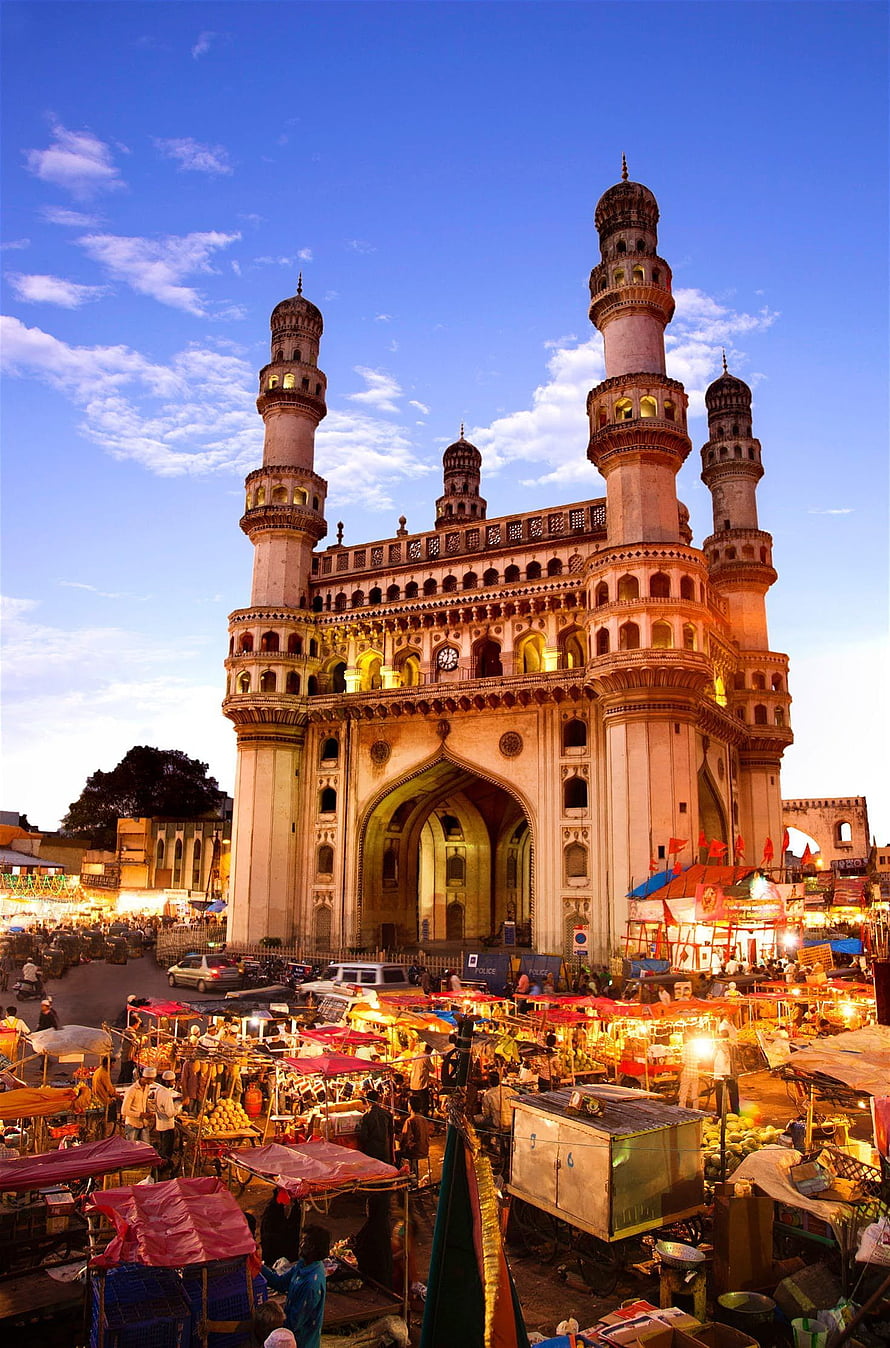 Charminar Gate at Dusk with Bustling Street Market in Hyderabad, India HD phone wallpaper