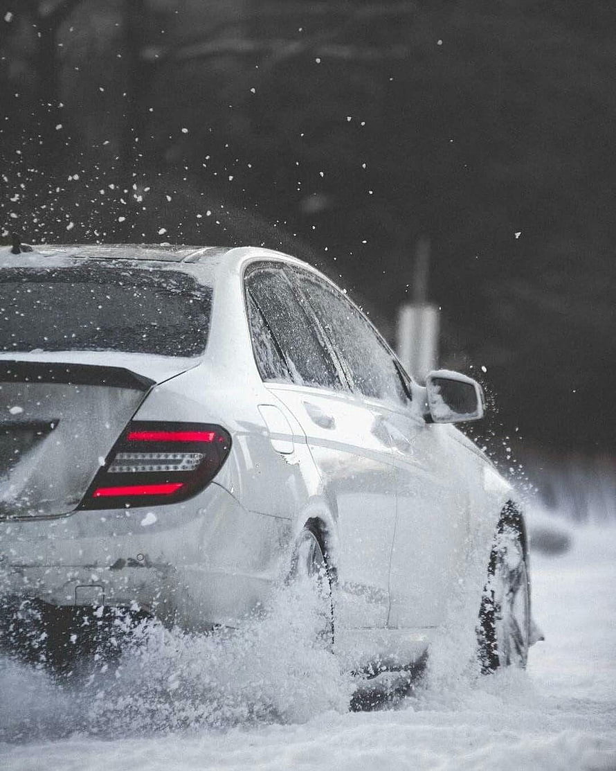 Mercedes C63 AMG W204 Estate Driving Through Deep Snow in Winter Storm HD phone wallpaper