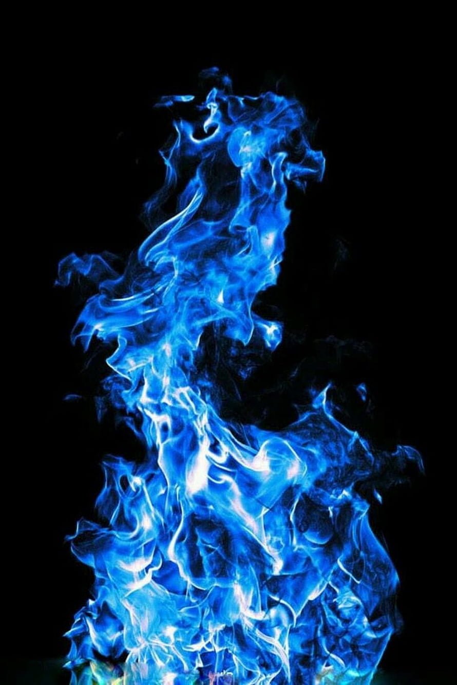Vibrant Blue Flame Rising Against a Dark Background HD phone wallpaper