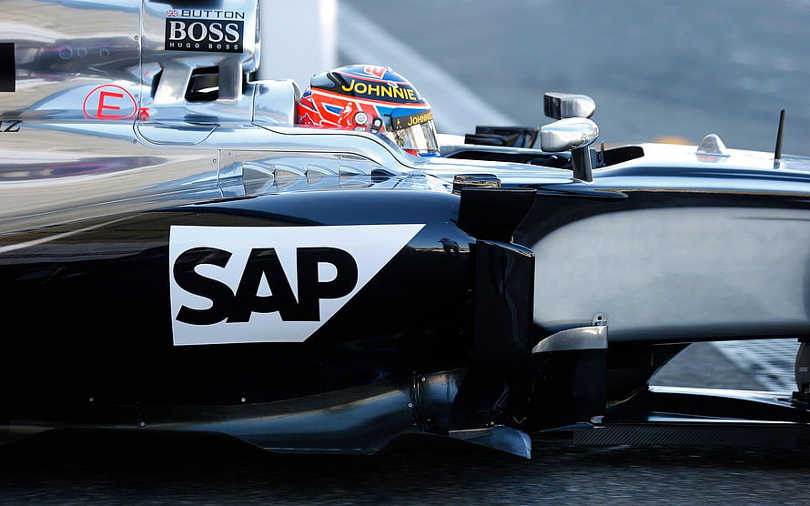 Close-up of a black and silver Formula 1 race car featuring prominent SAP and Boss sponsor logos on the sidepod and cockpit area HD wallpaper