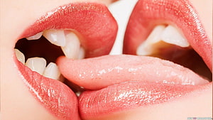 Close-Up of Two Pairs of Lips Sharing a French Kiss with Tongues Intertwined HD wallpaper