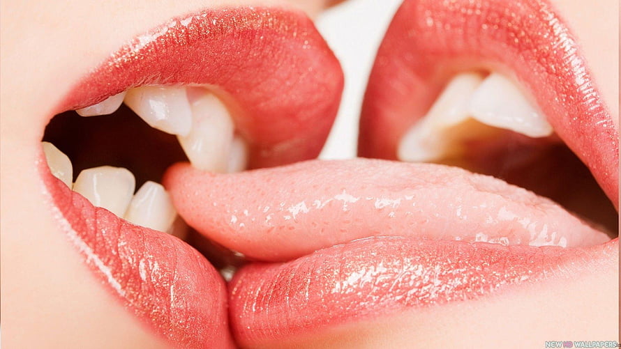 Close-Up of Two Pairs of Lips Sharing a French Kiss with Tongues Intertwined HD wallpaper