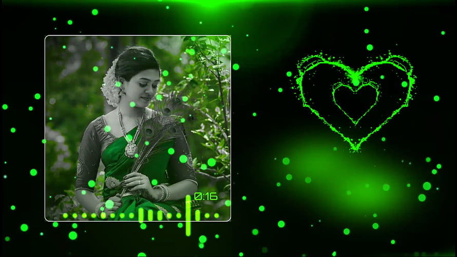 Green Saree Portrait with Glowing Heart and Particle Effects on Black Background HD wallpaper