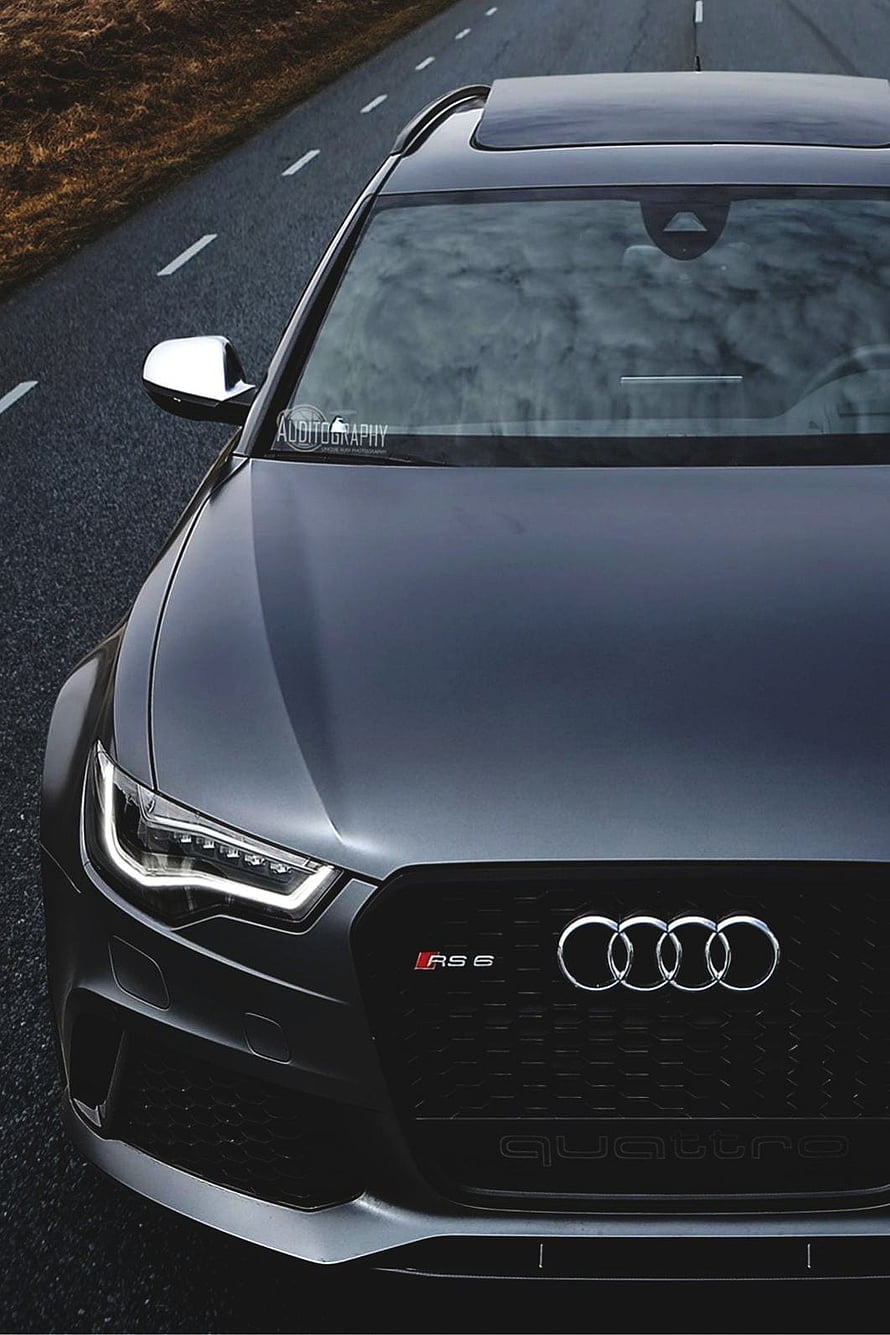 Audi RS6 Avant Front Grille and Headlight Detail on a Dark Road HD phone wallpaper