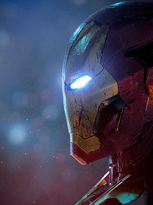 Damaged Iron Man Helmet Close-Up with Glowing Blue Eye in Dark Cinematic Setting, iron man 2022, #Iron Man HD phone wallpaper