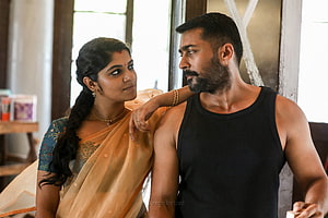 Suriya in Soorarai Pottru with woman in traditional saree HD wallpaper