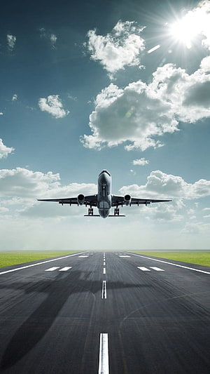 Commercial Jet Aircraft Taking Off From Runway Under Bright Blue Sky HD phone wallpaper
