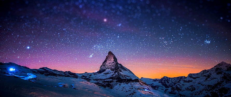 Matterhorn Peak Under a Starry Night Sky with Aurora and Winter Snow HD wallpaper