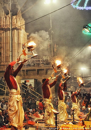 Ganga Aarti Ritual at Varanasi Ghat with Fire Lamps and Temple Architecture HD phone wallpaper