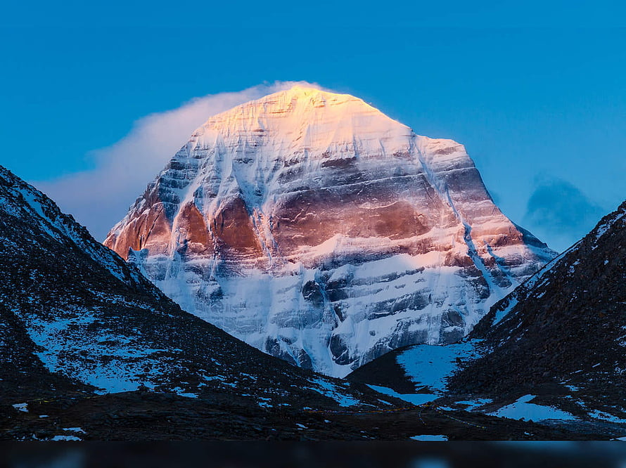 Mount Kailash Snow-Capped Peak at Sunrise with Golden Light and Blue Sky HD wallpaper