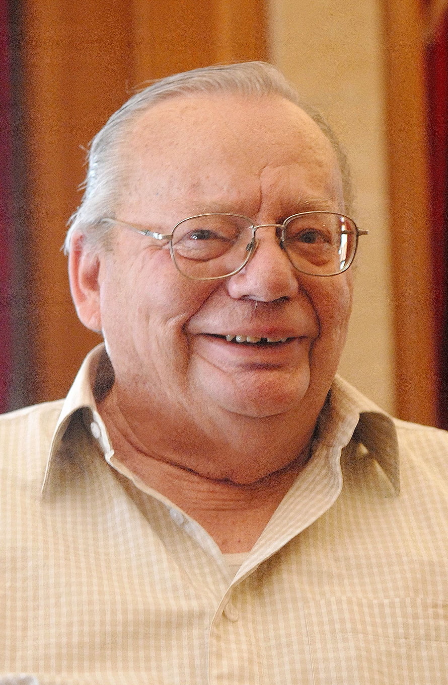 Ruskin Bond smiling portrait wearing glasses and a light checkered shirt HD phone wallpaper