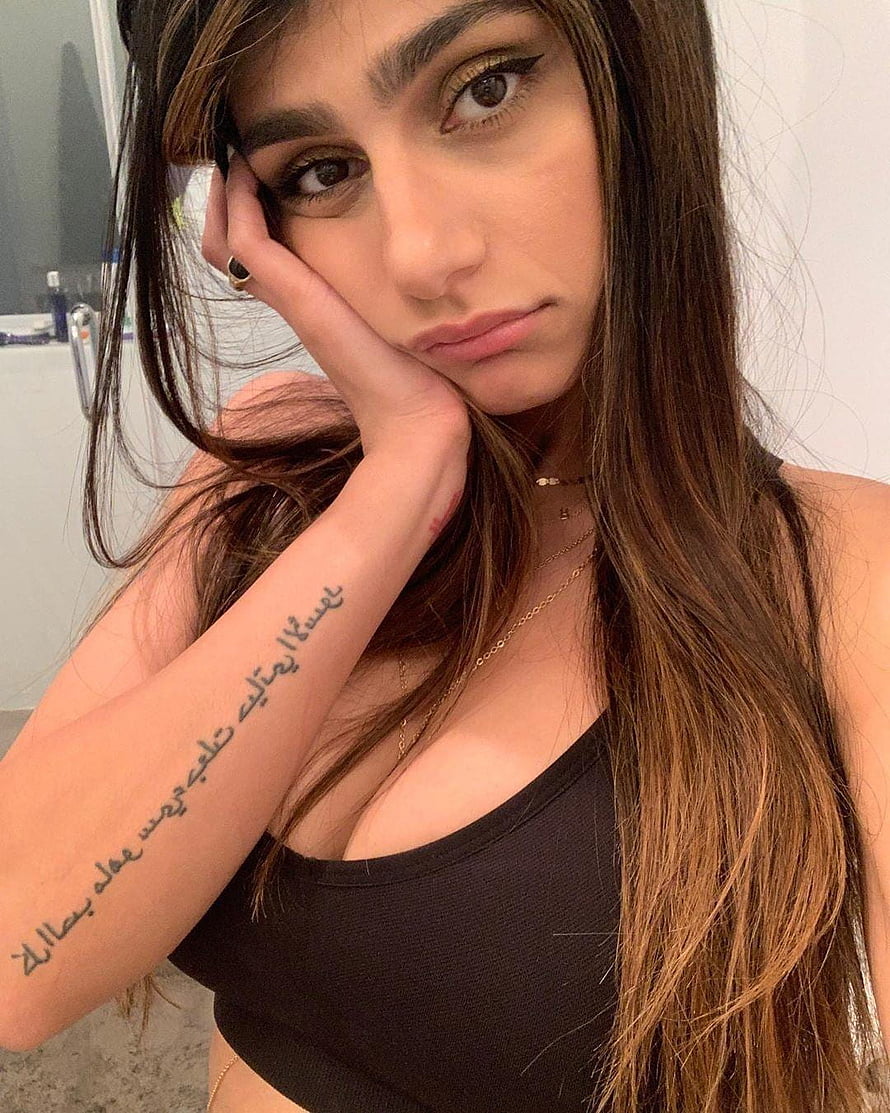 Mia Khalifa Close-Up Portrait With Long Hair And Arm Tattoo HD phone wallpaper