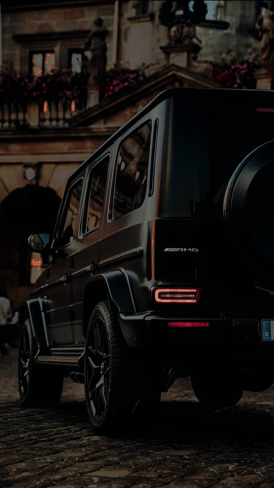 Black Mercedes-AMG G-Class SUV Rear View on Cobblestone Street at Night HD phone wallpaper