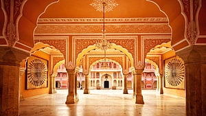Ornate Indian Palace Interior With Intricate Arches And Warm Terracotta Walls HD wallpaper