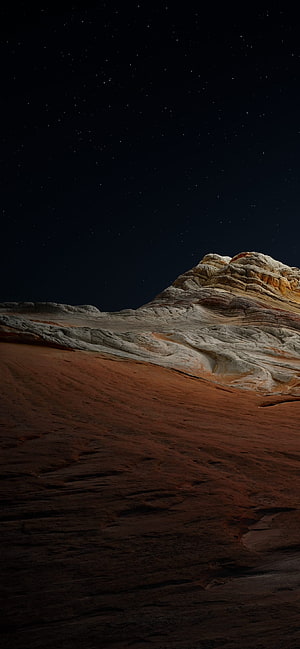 Alien Desert Landscape Under Starry Night Sky with Layered Rock Formations HD phone wallpaper