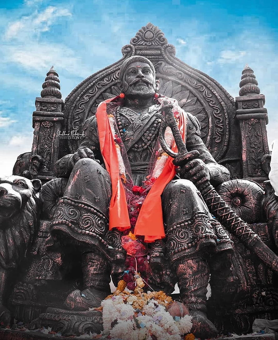 Chhatrapati Shivaji Maharaj Statue Seated on Throne with Sword and Red Garlands HD phone wallpaper