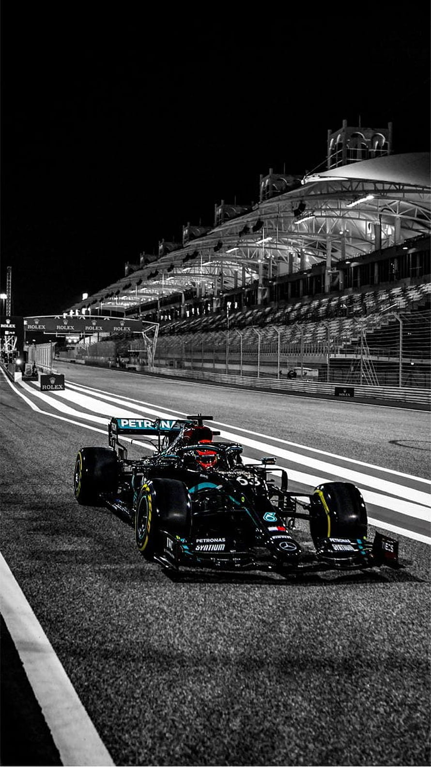 Mercedes-AMG Petronas Formula 1 car on the night race track HD phone wallpaper
