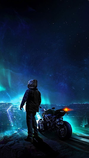 Biker Silhouette on Motorcycle Under Aurora Borealis Over Night City HD phone wallpaper
