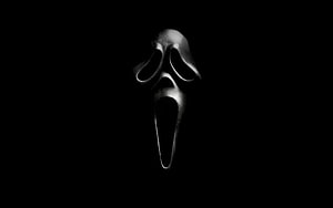 Ghostface Scream Mask in Dramatic Black and White Horror Portrait HD wallpaper