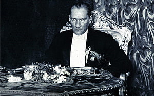 Mustafa Kemal Ataturk in Formal Attire Seated at an Ornate Table HD wallpaper